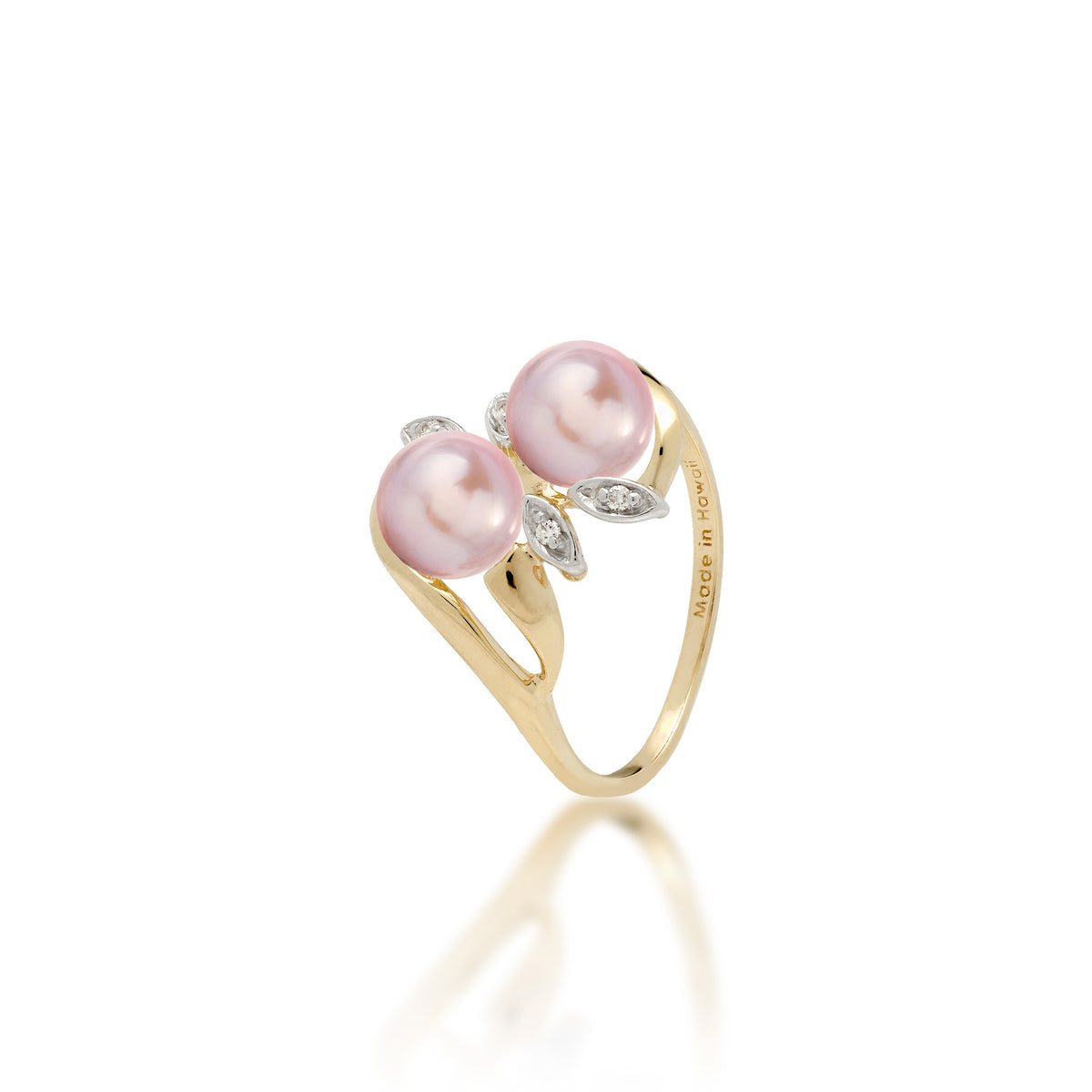 A 14k yellow gold ring with two lavender freshwater pearls and two diamond accent maile leaves on each side, shown on white background