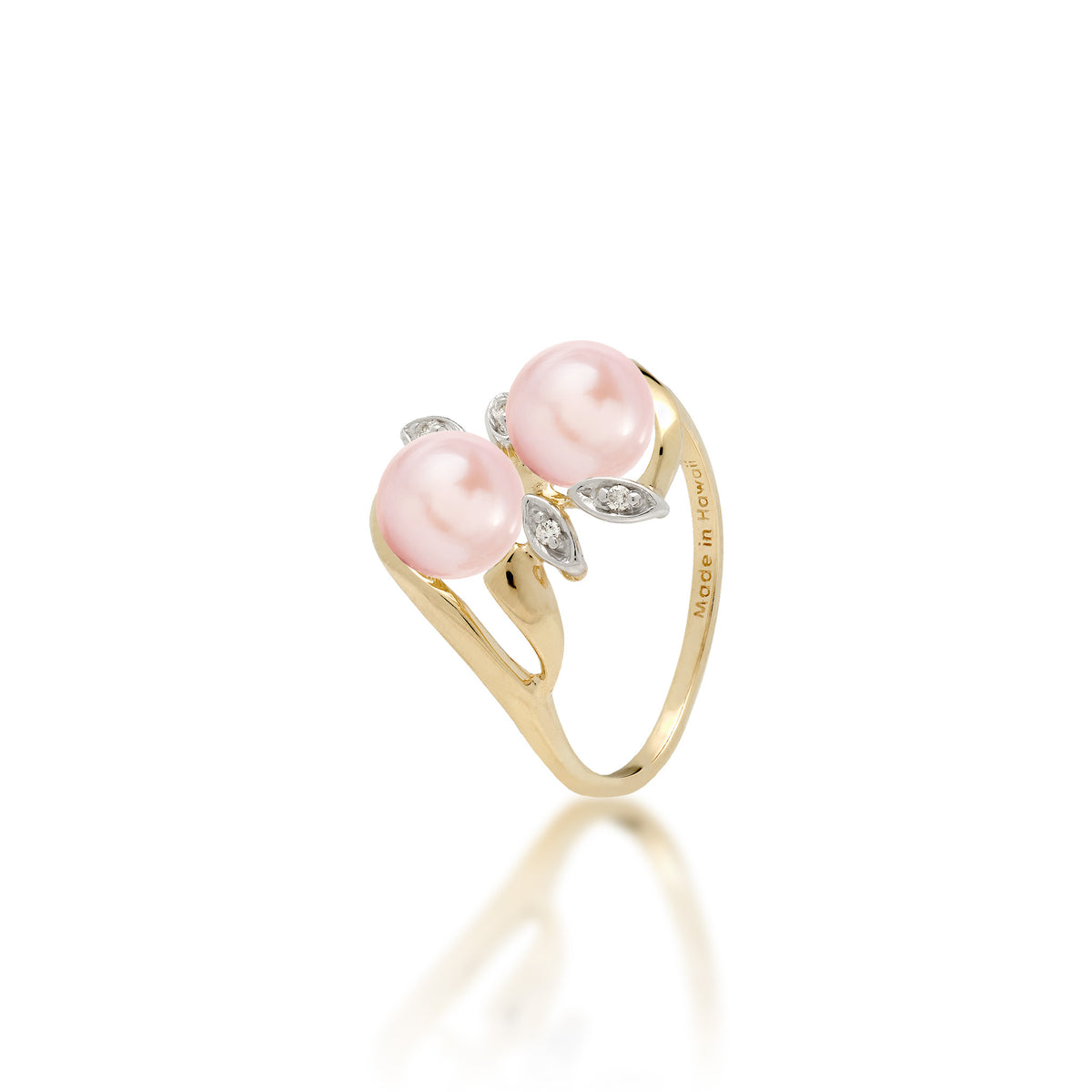 A 14k yellow gold ring with two white pink pearls and two diamond accent maile leaves on each side, shown on white background