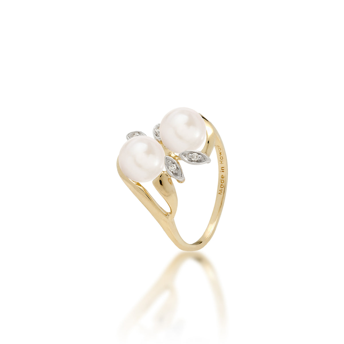 A 14k yellow gold ring with two white freshwater pearls and two diamond accent maile leaves on each side, shown on white background