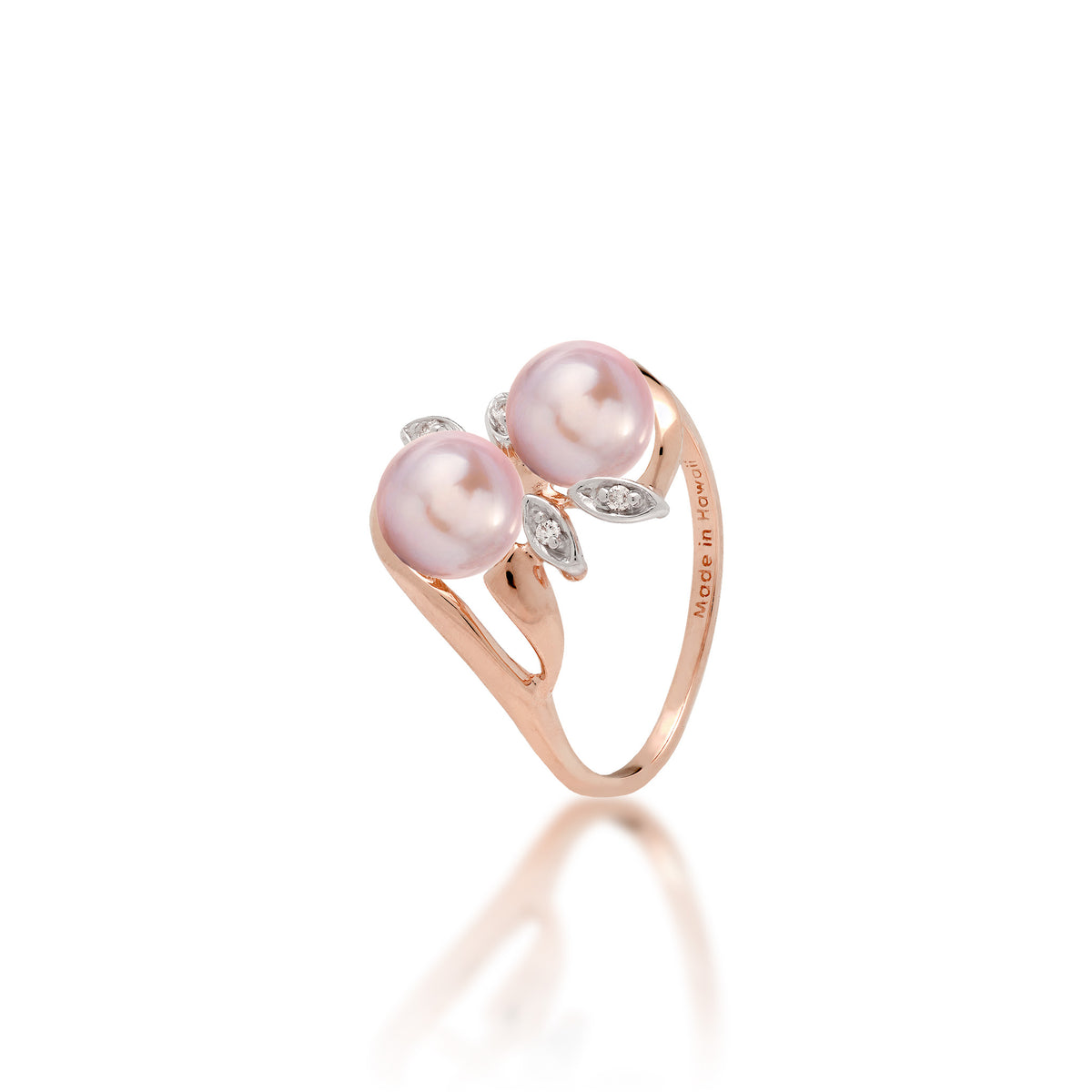 A 14k rose gold ring with two lavender freshwater pearls and two diamond accent maile leaves on each side, shown on white background
