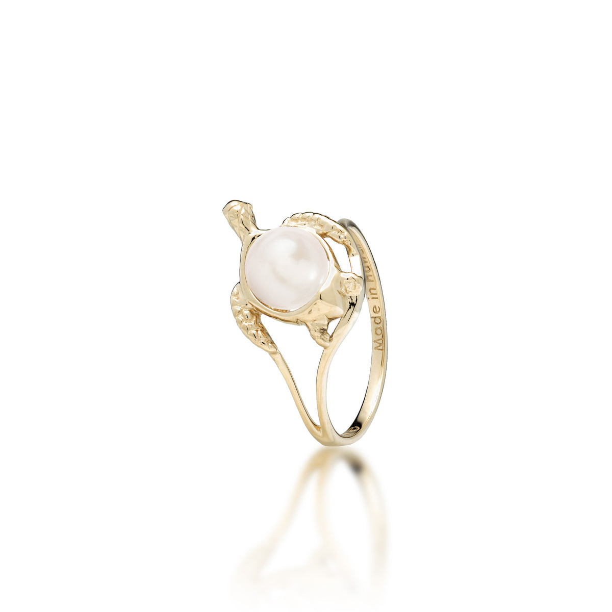 A 14k yellow gold sea turtle ring with a white freshwater pearl as its shell, shown on a white background