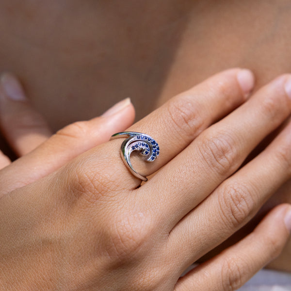 Close up of Nalu Ring in White Gold with Blue Sapphires - 15mm on hand