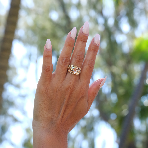 A woman's hand with a Hawaiian Gardens Hibiscus Ring in Tri Color Gold with Diamonds - 12mm - Maui Divers Jewelry\