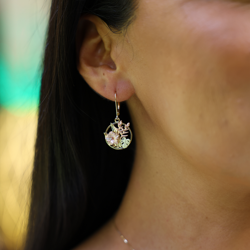 A woman's ear with HAwaiian Gardens Earrings in Tri Color gold with Diamonds - 15mm - Maui Divers Jewe;ry