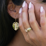 A woman wearing a Hawaiian Gardens Hibiscus Ring in Tri Color Gold with Diamonds - 8mm - Maui Divers Jewelry