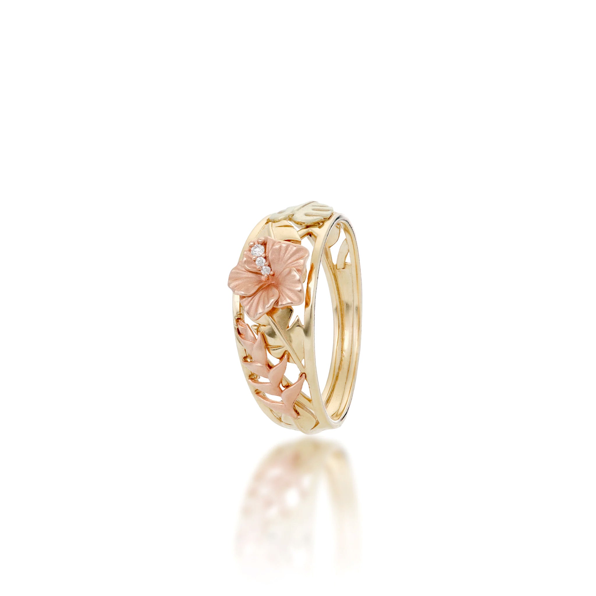 Angle view of the Hawaiian Gardens Collection 8mm Ring in 14k Yellow Gold with a diamond rose gold hibiscus crown, high-polish banana leaves, rose gold heliconia, and green gold monstera on a white background.