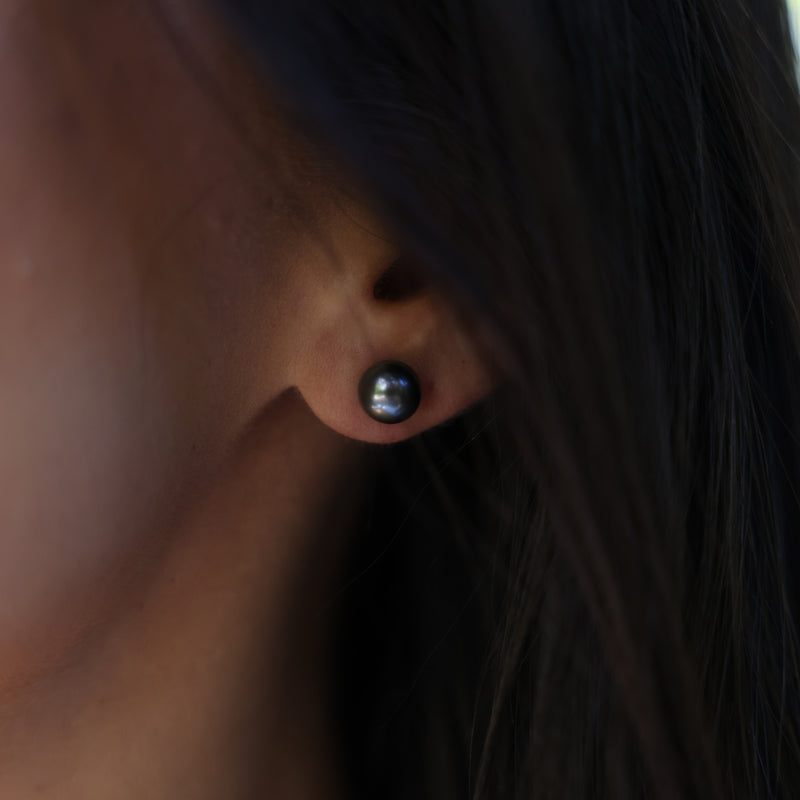 close up of Tahitian Black Pearl Earrings in White Gold - 8-9mm on ear
