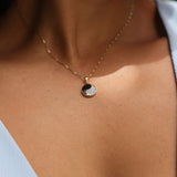 Close up of Yin Yang Black Coral Pendant in Gold with Diamonds - 12mm on Neckline