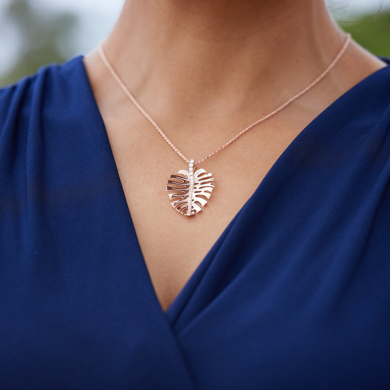 A woman wearing a 18" 1.0mm Flex Rope Chain in Rose Gold with a Monstera Pendant - Maui Divers Jewelry