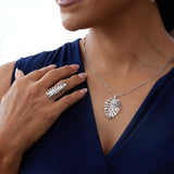 A woman wearing a Monstera Ring in White Gold and a necklace - Maui Divers Jewelry
