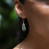 A womanʻs ear with Sealife Earrings in Gold with Diamonds - 254mm - Maui Divers Jewelry
