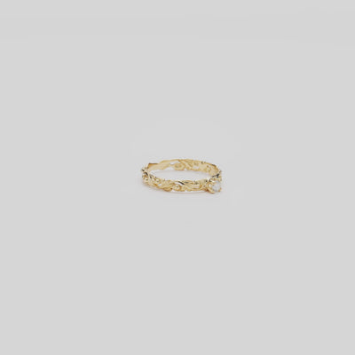 Video of the 3mm Living Heirloom Ring in Gold with Diamond turning on a white background
