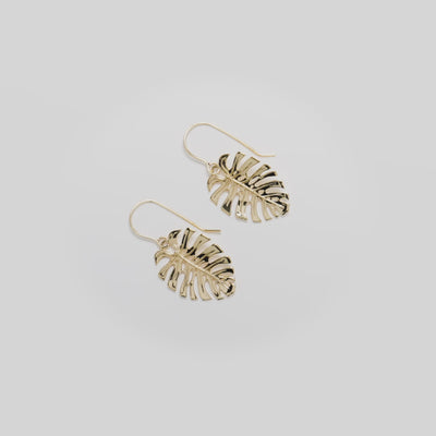 Video showcasing the 23mm Monstera Shepherd's Hook Earrings in 14k Yellow Gold