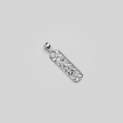 Video of the 32mm Hawaiian Heirloom Plumeria Pendant in Sterling Silver with White Sapphire turning on a white background