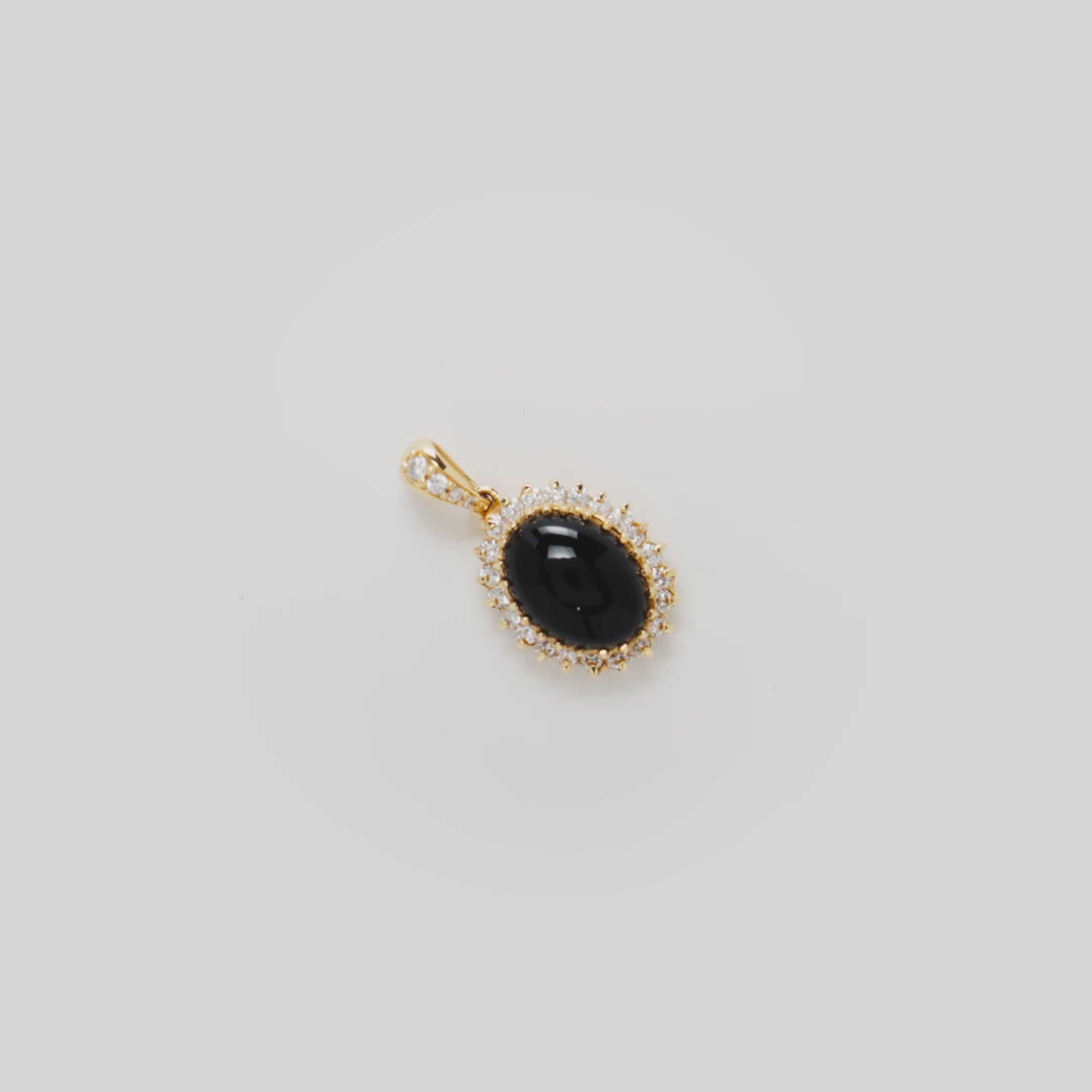 Video showcasing the 18mm Princess Ka‘iulani Black Coral Pendant in 14k Yellow Gold with Diamonds on a turn table