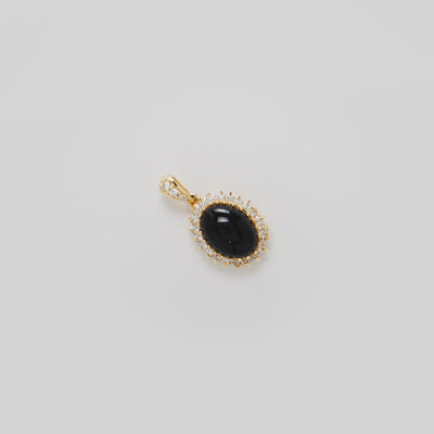 Video showcasing the 18mm Princess Ka‘iulani Black Coral Pendant in 14k Yellow Gold with Diamonds on a turn table
