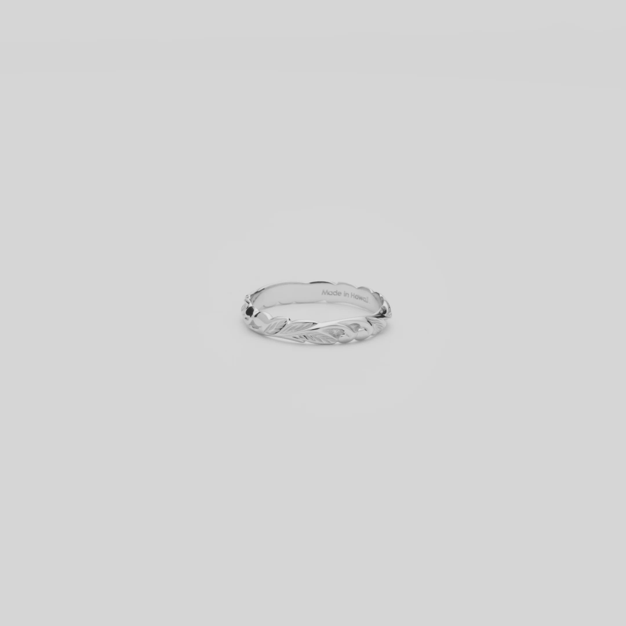 Video of the 3mm Hawaiian Heirloom Old English Scroll Ring in White Gold turning on a white background