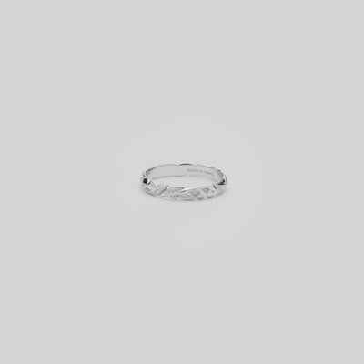 Video of the 3mm Hawaiian Heirloom Old English Scroll Ring in White Gold turning on a white background