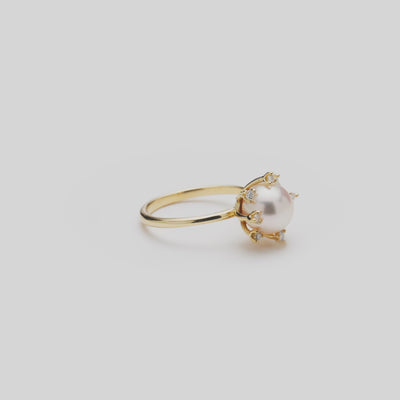 Video of the 8mm Protea Akoya White Pearl Ring in Gold with Diamonds turning on a white background
