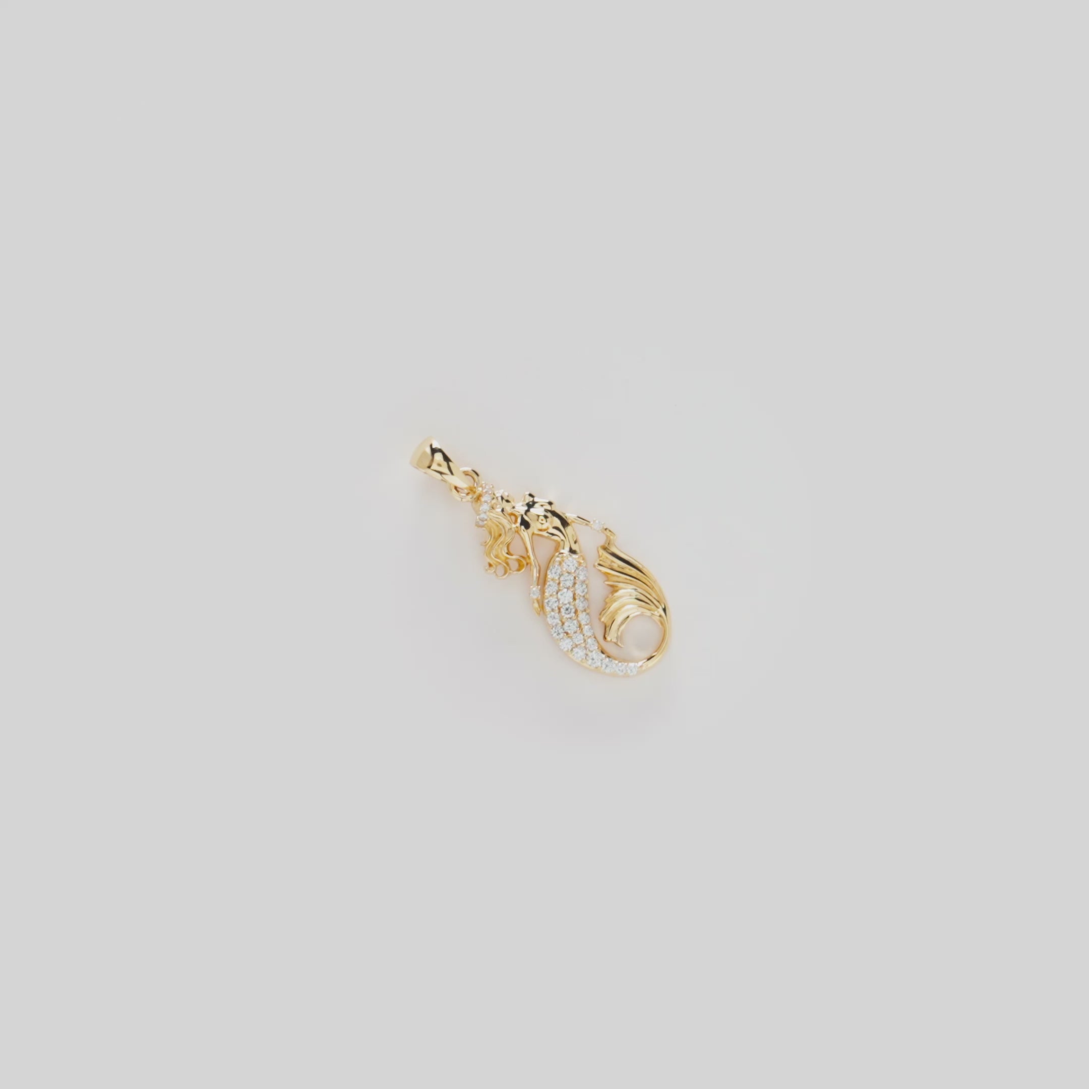 Video showcasing the Mermaid Pendant in 14k Yellow Gold with Diamonds