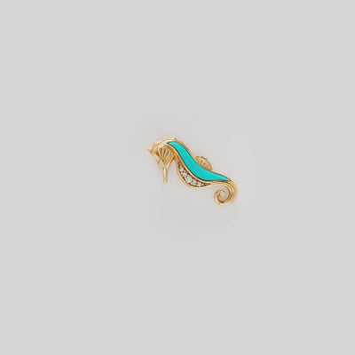 Video showcasing the Seahorse Turquoise Pendant in 14k Yellow Gold with Diamonds