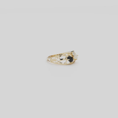 Video of the Black Coral Ring in Gold with Opal and Diamond turning on a white background