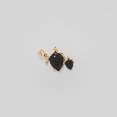 Video showcasing the 22mm Honu Black Coral Pendant in 14k Yellow Gold on a white background