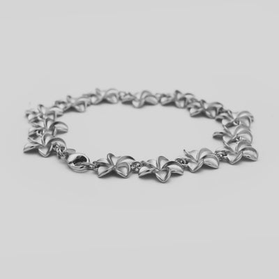 Video of the 7.75-8" Plumeria Bracelet in Sterling Silver turning on a white background