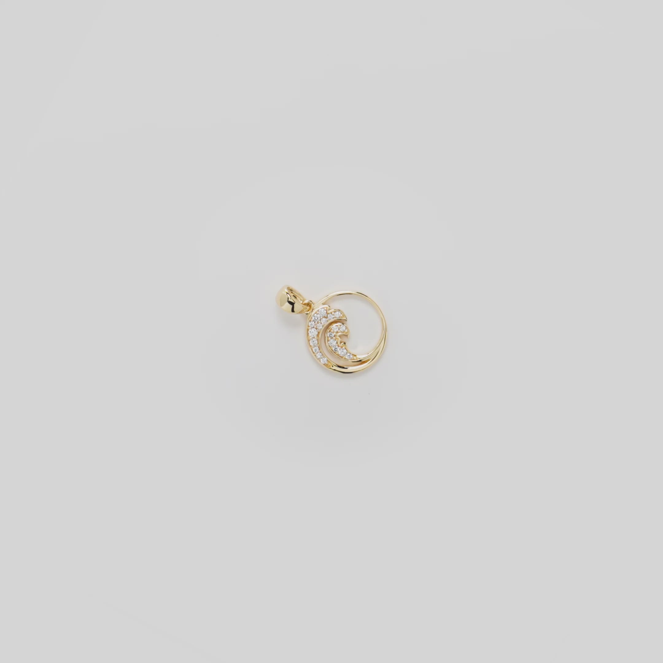 Video showcasing the 12mm Nalu Pendant in Gold with Diamonds on a turn table