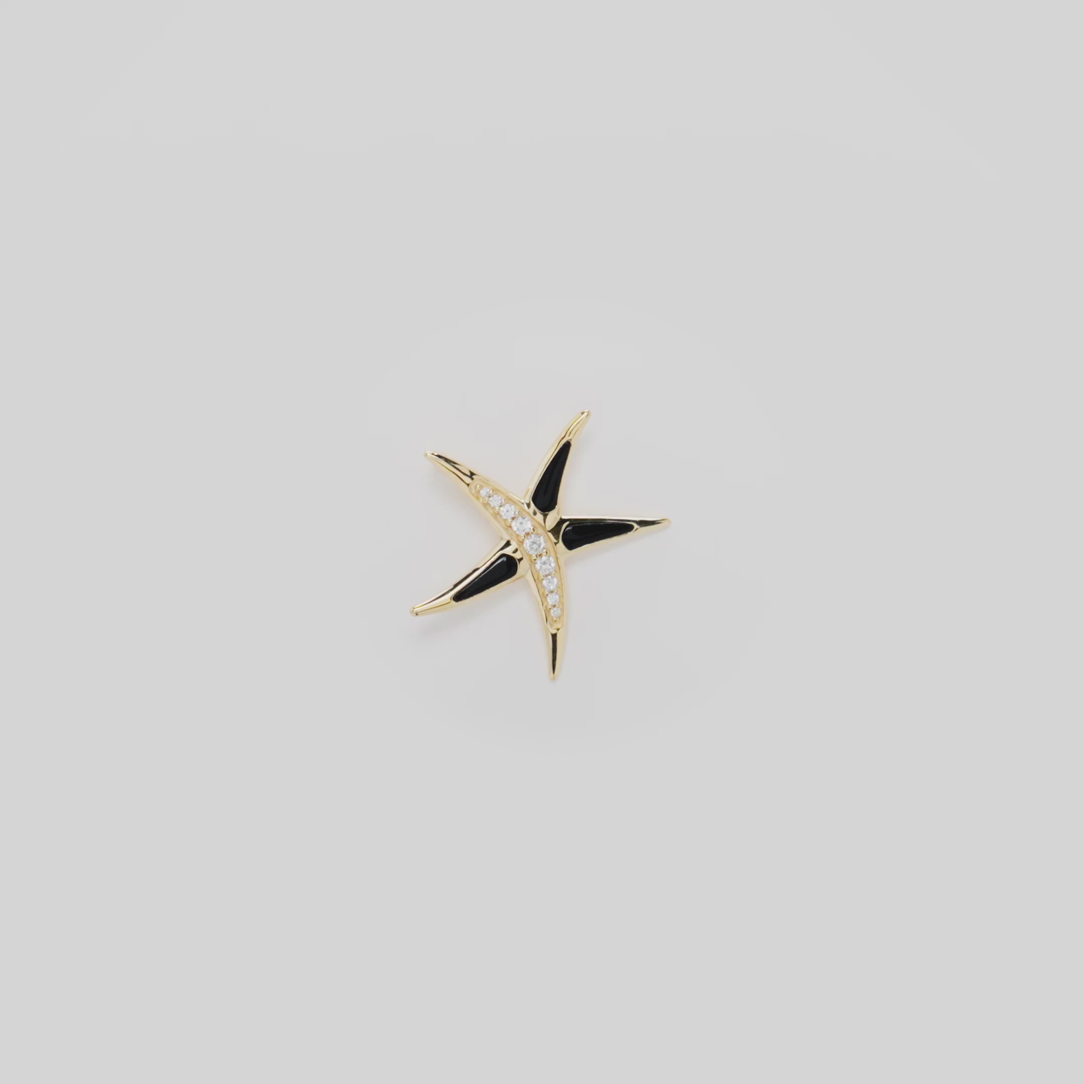 Video showcasing the Starfish Hawaiian Black Coral Pendant in 14k Yellow Gold with Diamonds on a turn table