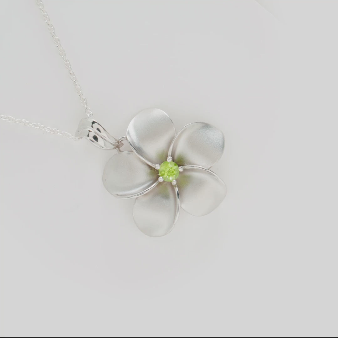 Video showcasing the 18" Plumeria Peridot Necklace in Sterling Silver on turn table