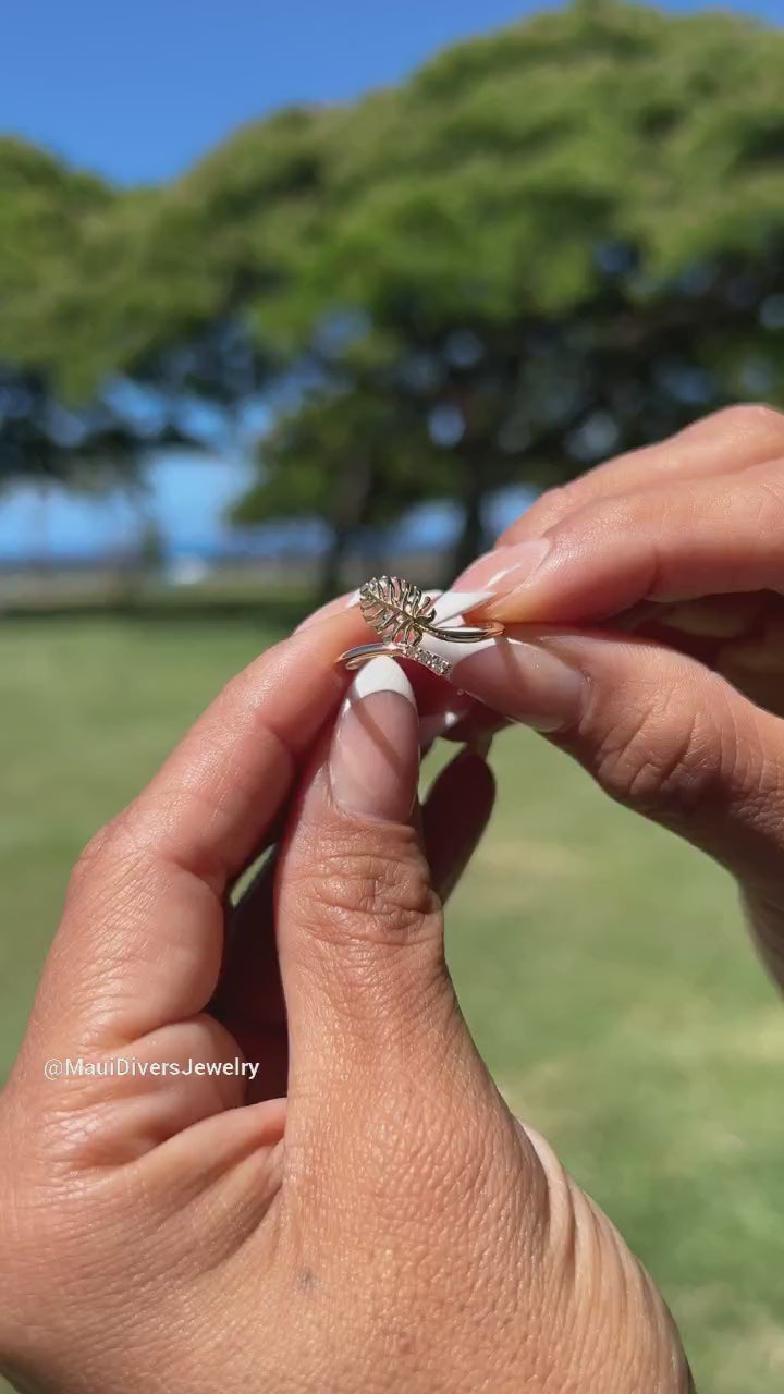 Video of a woman's hand wearing a Monstera Ring in Gold with Diamonds - Maui Divers Jewelry