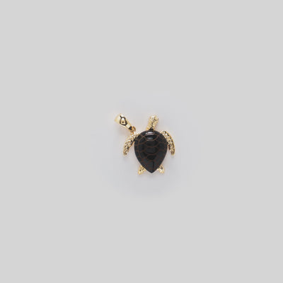 Video showcasing the 19mm Honu Black Coral Pendant in 14k Yellow Gold with Diamonds