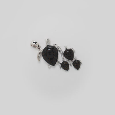 Video showcasing the 36mm Honu Black Coral Pendant in 14k white gold on a turn table