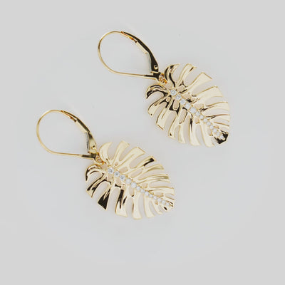 Video showcasing the 23mm Monstera Earrings in 14k Yellow Gold with Diamonds on a turn table