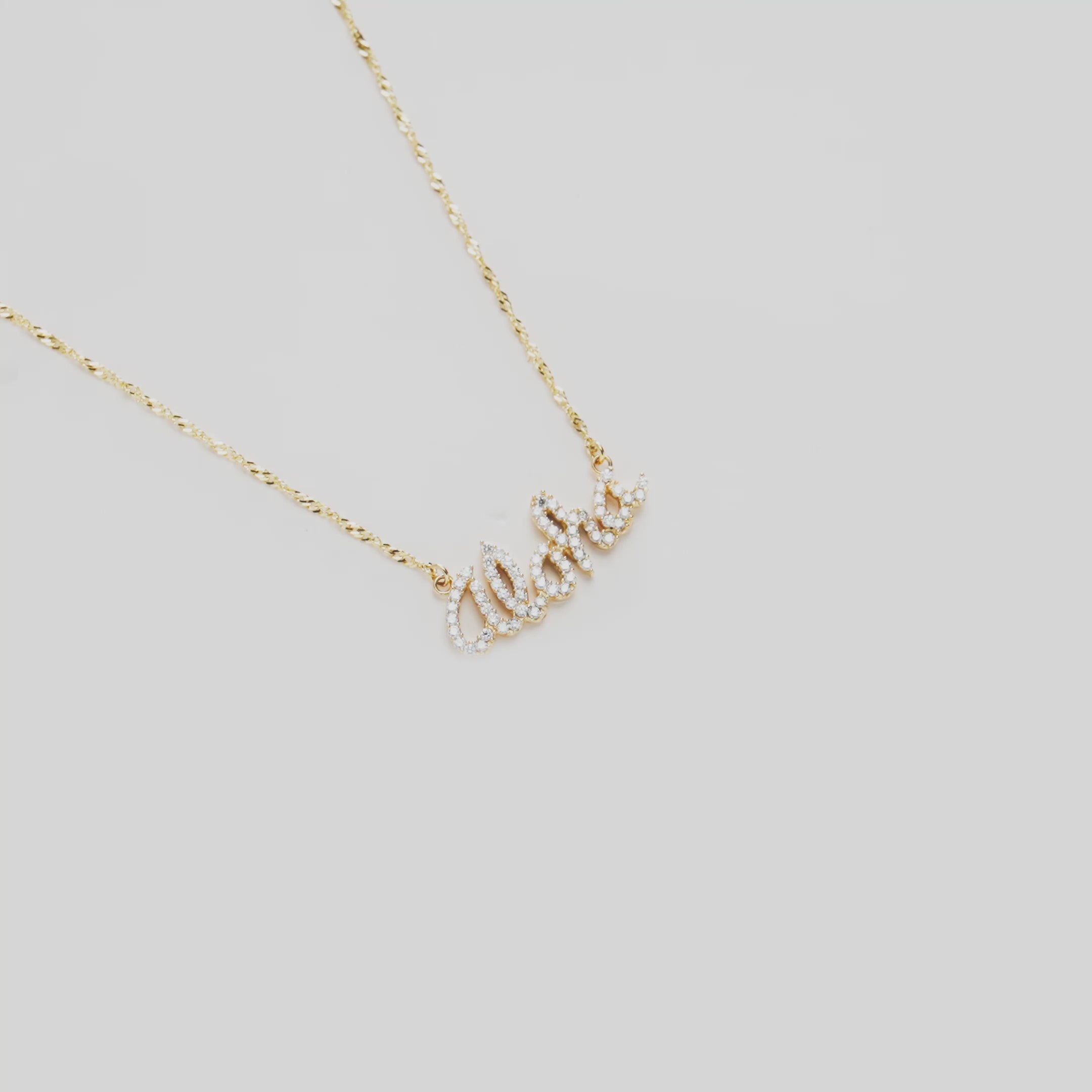 Video of the 16" Aloha Necklace in Gold with Diamonds turning on a white background