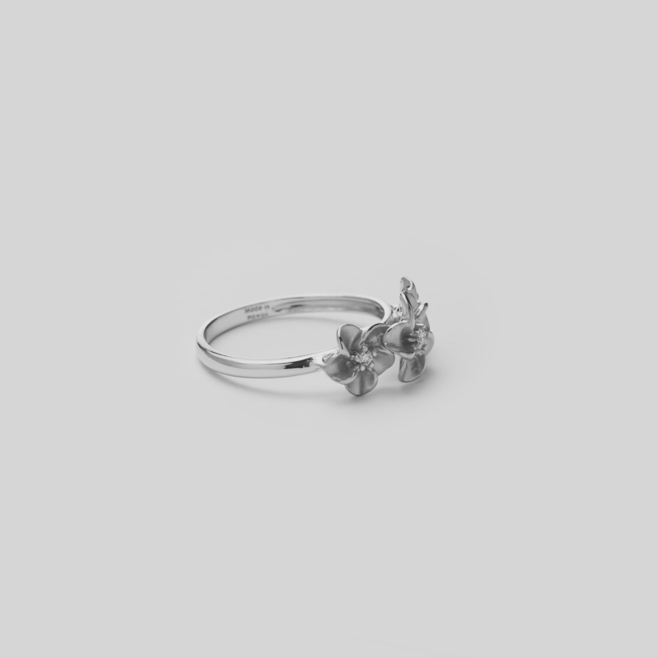 Video showcasing the 8mm Plumeria Ring in 14k White Gold with Diamonds 