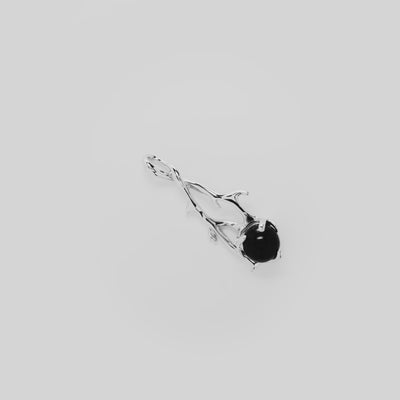 Video showcasing the 39mm Heritage Black Coral Pendant in 14k White Gold on a turn table