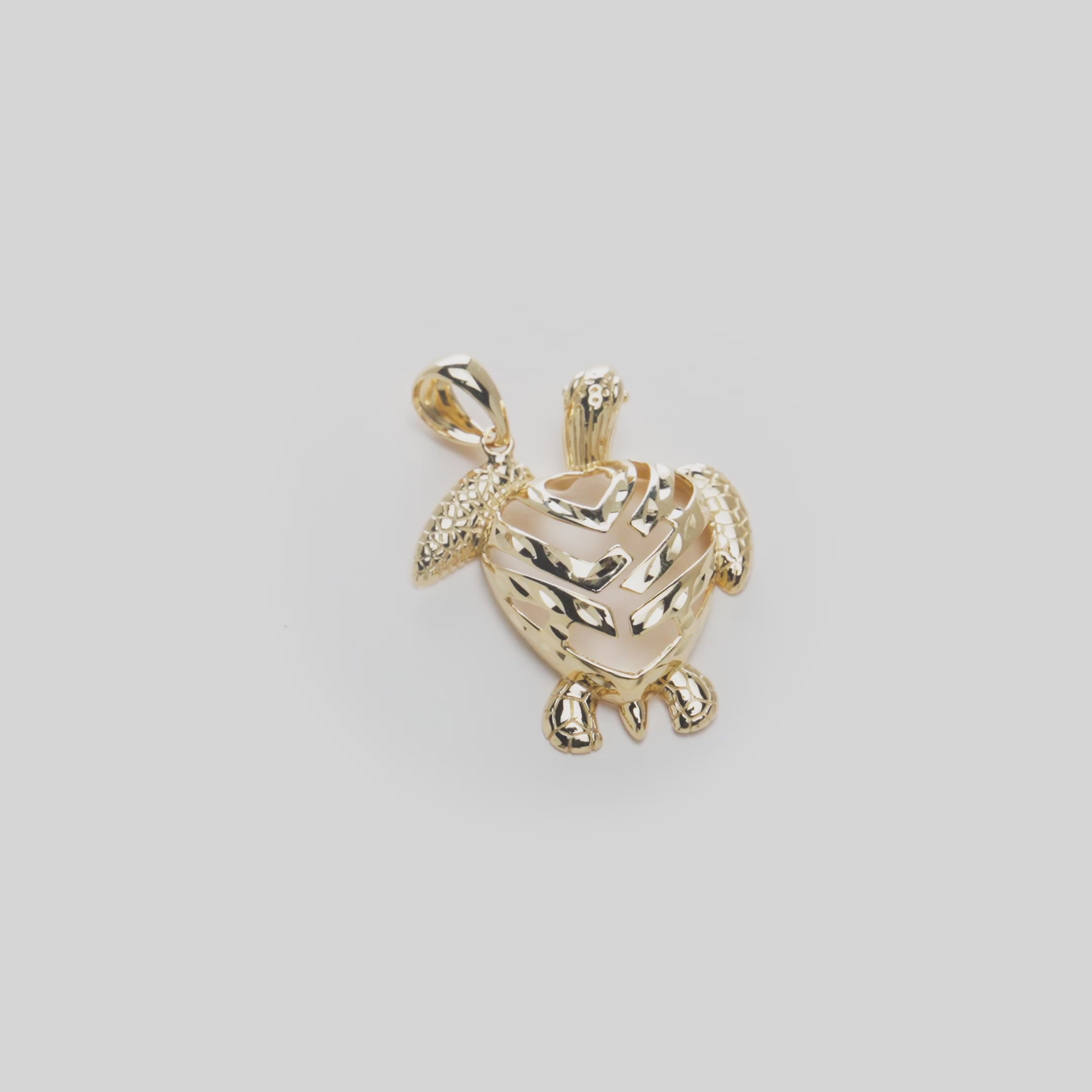 Video of the Sea Turtle Aloha Heart Pendant in 14k Yellow Gold on a Turn Table