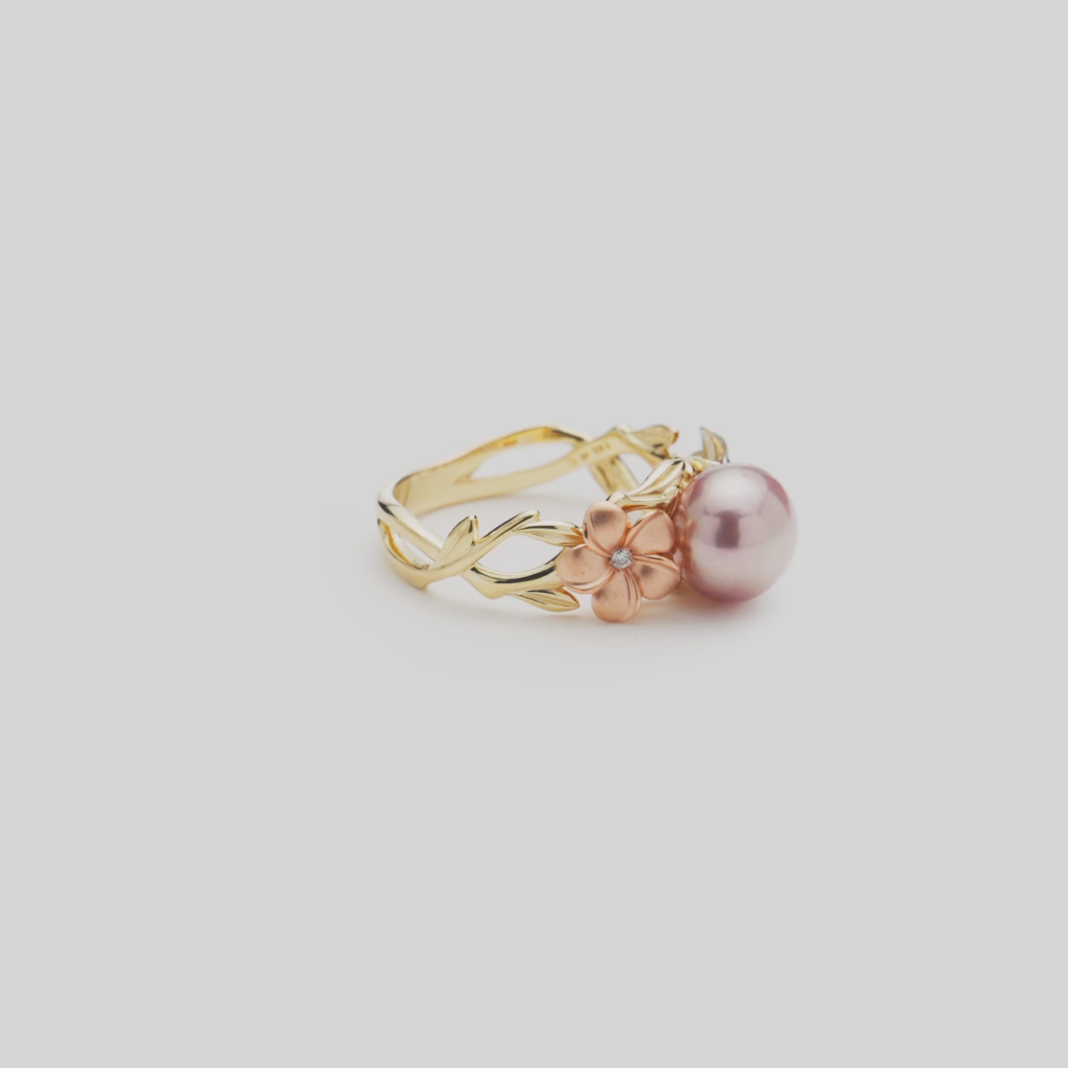 Video of the 8mm Pearls in Bloom Plumeria Lavender Freshwater Pearl Ring in Tri Color Gold with Diamonds turning on a white background