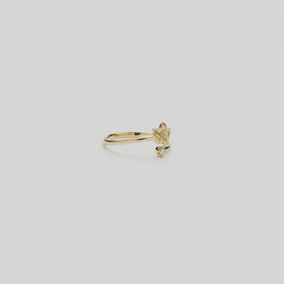 Video of the 6mm Plumeria Ring in Gold with Diamond turning on a white background