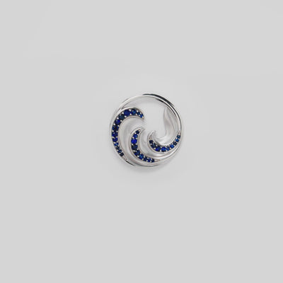Video of the 24mm Nalu Pendant in White Gold with Blue Sapphires on a turn table