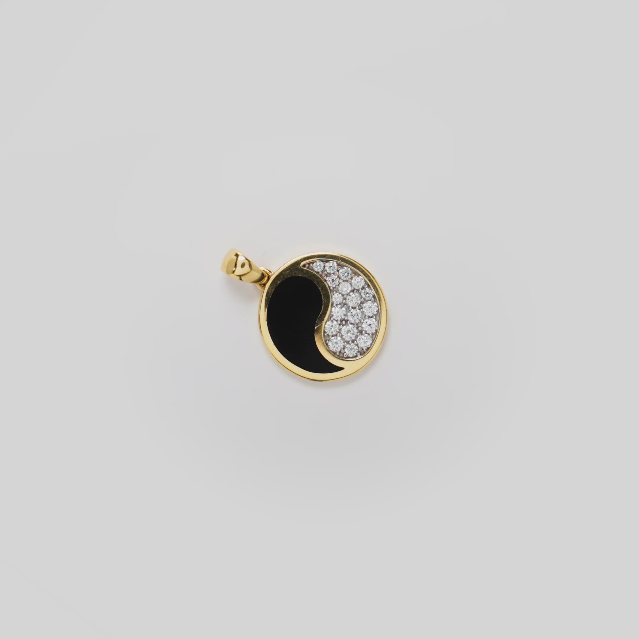 Video showcasing the 18mm Yin Yang Black Coral Pendant in 14k Yellow Gold with Diamonds on a white background
