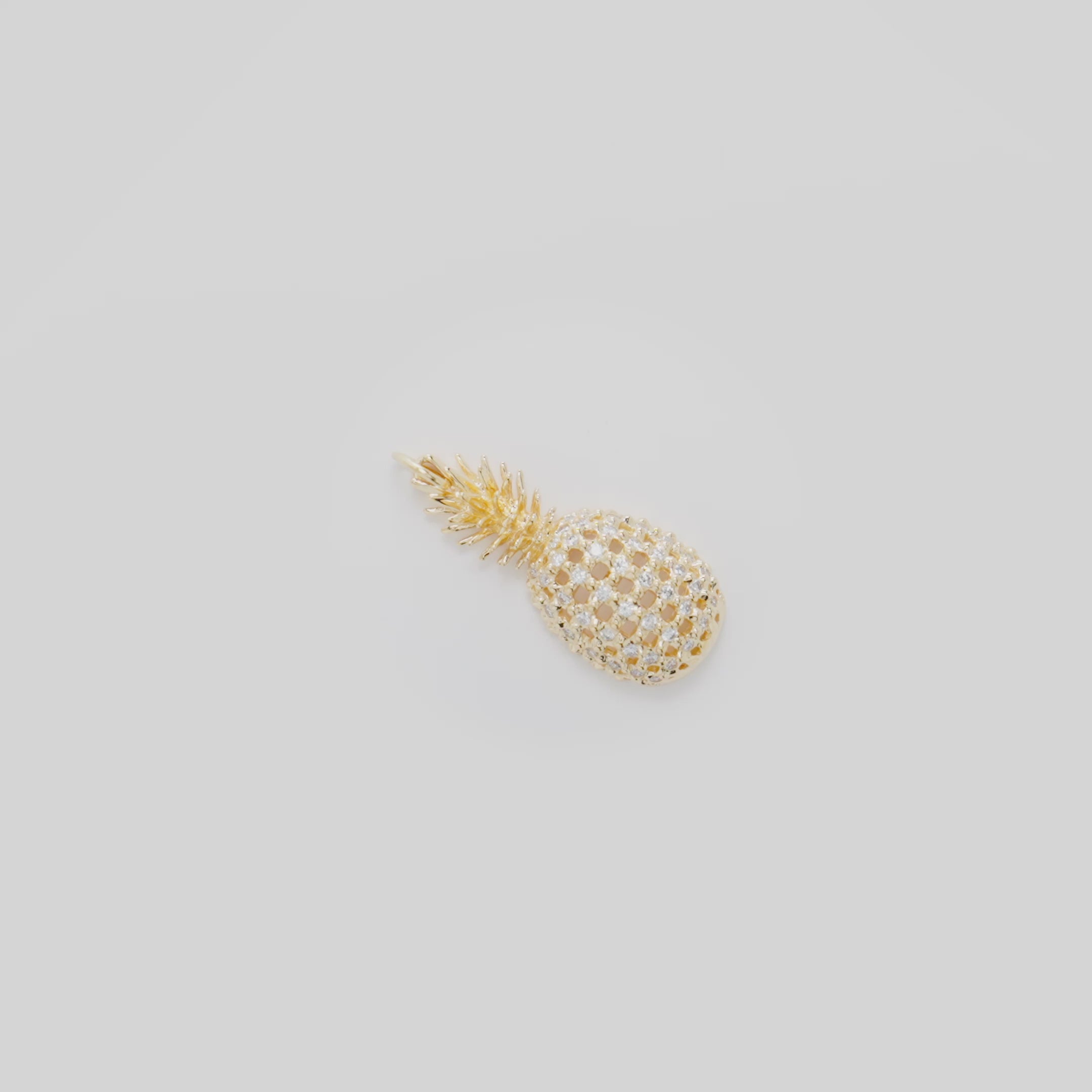 Video showcasing the 30mm Pineapple Pendant in 14k Yellow Gold with Diamonds on a turn table