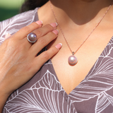 A woman's hand wearing a Ultra Violet Freshwater Pearl Ring with Diamonds in Rose Gold (14-15mm)-Maui Divers Jewelry