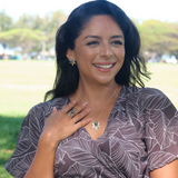 A woman wearing The E Hoʻāla Tahitian Black Pearl Collection in Gold with Diamonds - Maui Divers Jewelry