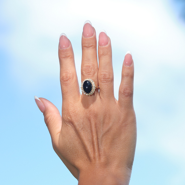 A woman's hand wearing a Princess Ka‘iulani Black Coral Ring in Gold with Diamonds-Maui Divers Jewelry