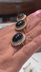 Video of a woman's hand wearing three sizes of the Princess Ka‘iulani Black Coral Ring in Gold with Diamonds-Maui Divers Jewelry