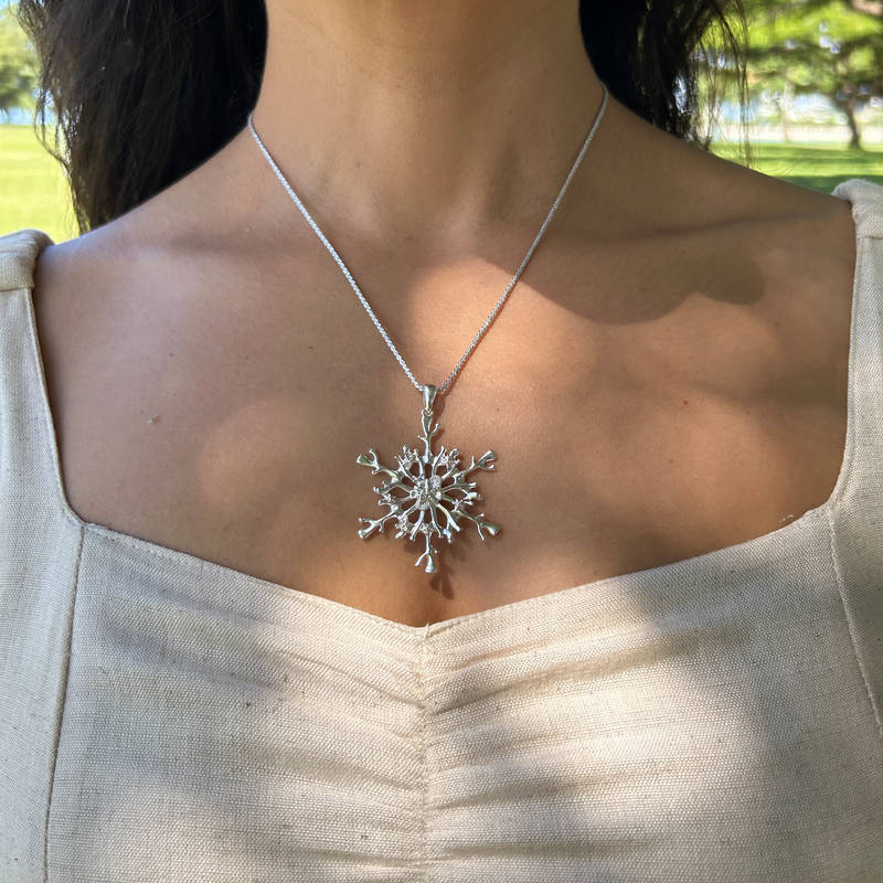 2022 Limited Edition Hawaiian Snowflake Ornament in Sterling Silver on a woman - Maui Divers Jewelry