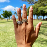 A woman's hand with two Hawaiian Heirloom Engagement Ring in White Gold with Diamonds - 12mm-Maui Divers Jewelry